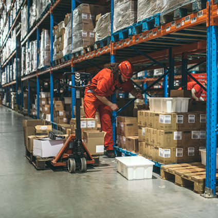 man unloading boxes in warehouse